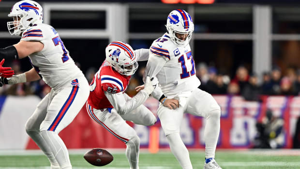Dec 1, 2022; Foxborough, Massachusetts, USA; Buffalo Bills quarterback Josh Allen (17) fumbles the ball after a sack by New England Patriots linebacker Josh Uche (55) during the first half at Gillette Stadium.
